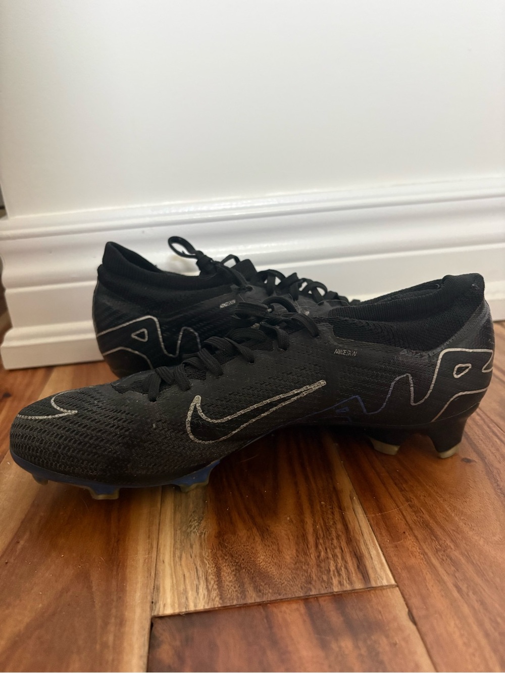 Nike Men’s Black Soccer Cleats with Subtle Blue Accents